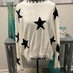Cream and black sweater with star pattern